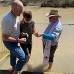 Renewing our Baptismal vows in the Jordan River.